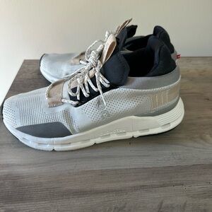 Women’s black, gray and tan athletic shoes